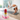 Person practicing yoga in a bright room with a colorful candle and crystals on a mat.