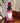Decorative stack of colorful stacked vases on a Buddha head sculpture